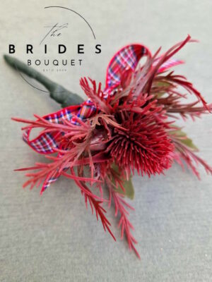 Red thistle wedding buttonhole with artificial sea holly corsage