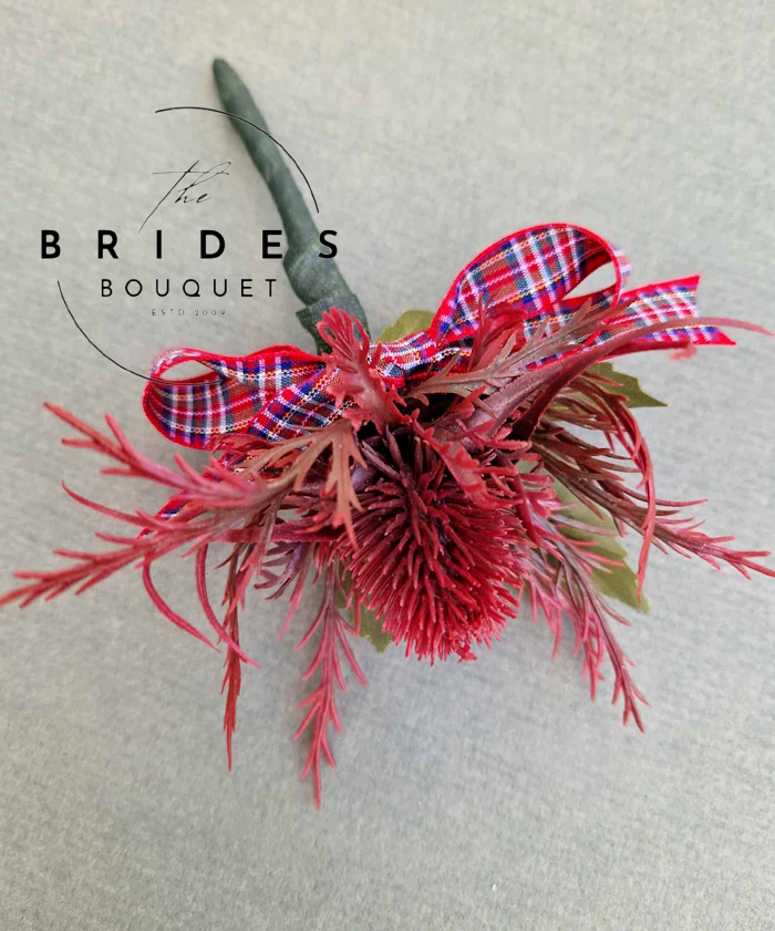 deep red thistle wedding buttonholes scottish thistles with tartan bow