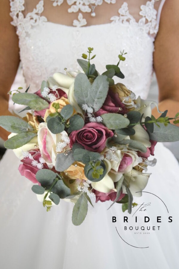 Silk and faux rose wedding bouquet with calla lily and natural look foliage