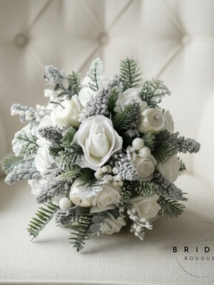 White and silver bridal bouquet for Christmas wedding with glitter roses and spruce berries