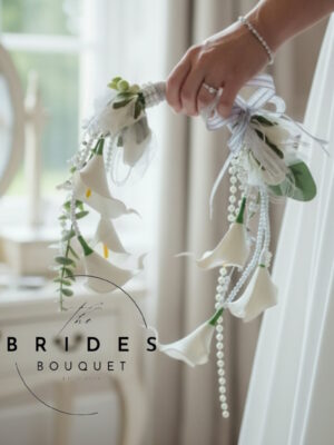 modern calla lily and pearl wedding bouquet with draping pearls