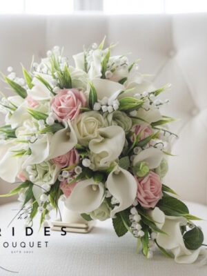 brides tear bouquet of roses calla lily and lily of the valley artificial bridal flowers in dusky pink