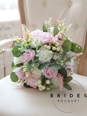 pink silk wedding bouquet with pastel pink and ivory roses hand-tied with foliage heather and berries ready to ship