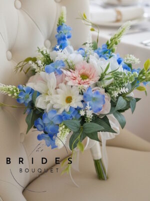 Summer wedding bouquet for bride in pastel pink blue and ivory tones