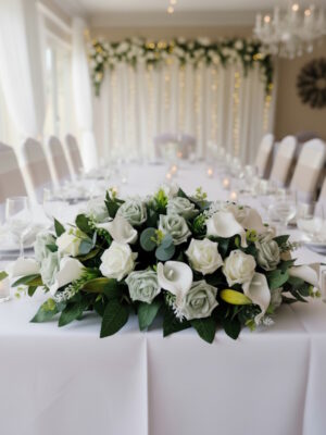 top table wedding flowers with roses calla lily and astilbe arrangement