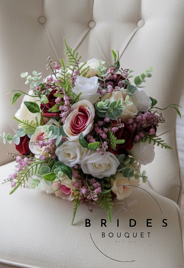 Pink and burgundy silk wedding bouquet with ivory roses burgundy roses and dusky pink lily of the valley ready for fast dispatch Pink and burgundy silk wedding bouquet with ivory roses burgundy roses dusky pink lily of the valley and natural foliage ready for fast delivery one-off bridal bouquet