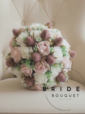Pink Scottish thistle wedding flowers with roses in handmade bridal bouquets and matching wedding flower arrangements