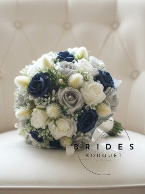 Ivory thistle wedding bouquet with roses and foliage in handmade Scottish bridal design