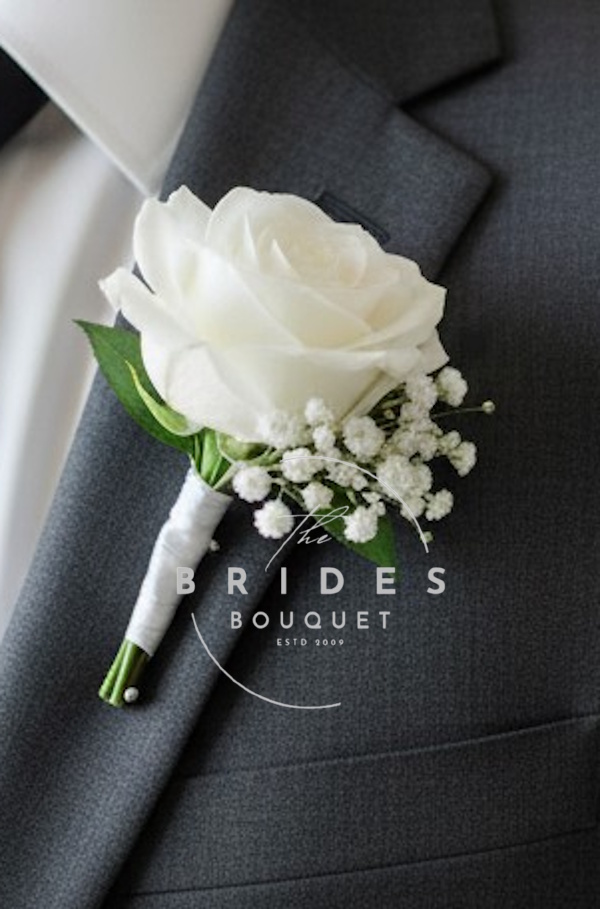 silk rose grooms buttonhole with lots of gypsophila Gypsophila silk rose buttonhole with ribbon wrapped stem