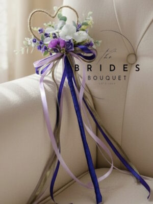 Purple boho wedding flower wand with bluebells, hydrangeas, frosted eucalyptus and ribbon roses
