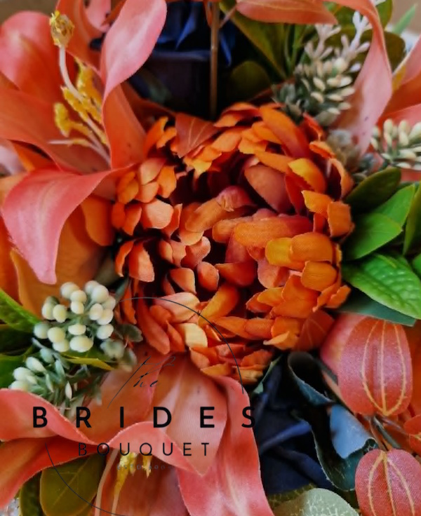 burnt orange and navy wedding bouquet close up