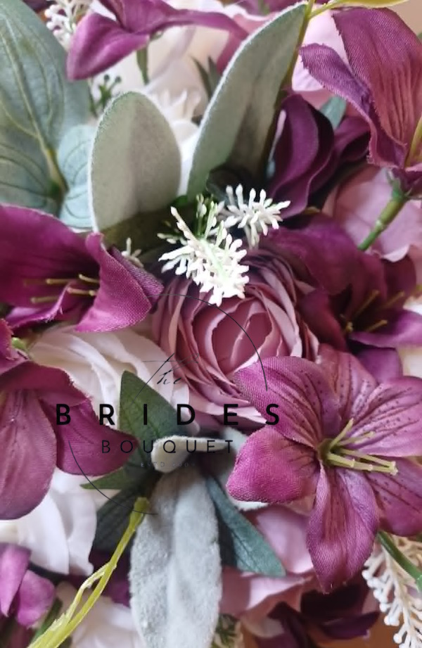 mauve pink silk wedding boquuet close up orchid and roses