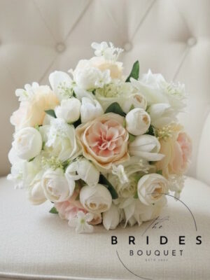 Peach pink and ivory bridal bouquet with silk roses, tulips and ranunculus