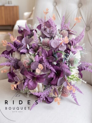 Ivory and mauve silk wedding bouquet with matching buttonhole