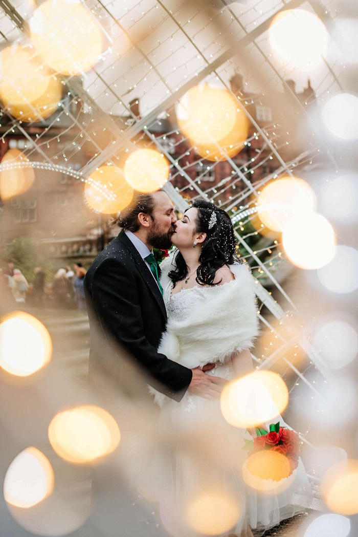 rock and roll wedding sheffield bride and groom with faux red rose bouquet by the brides bouquet uk