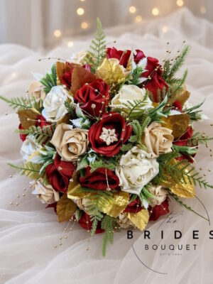Red, gold and ivory winter bridal bouquet with diamante rose centres, gold foliage and pearl brooch, ready to ship