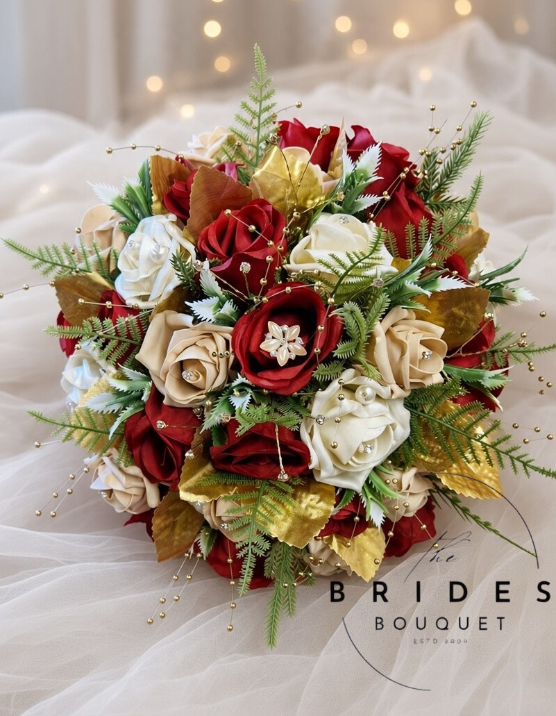 red and gold winter wedding bouquet ready to ship one off brides flowers uk Red, gold and ivory winter bridal bouquet with diamante rose centres, gold foliage and pearl brooch, ready to ship